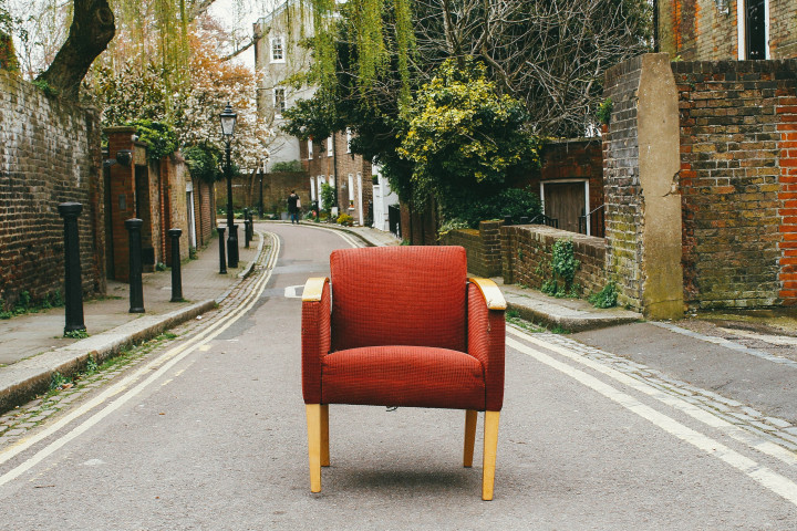 Broken down chair in the middle of the street